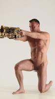 MICHAEL NAKED MAN KNEELING POSE WITH GUNS